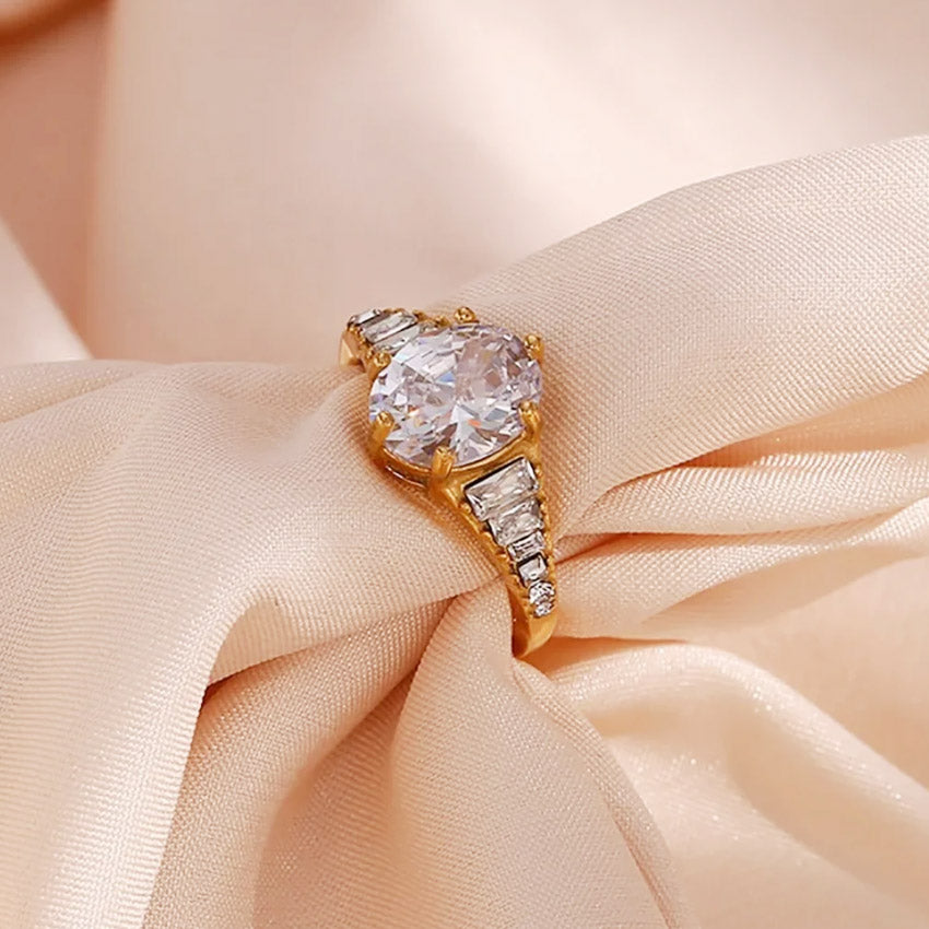 Detailed view of the white zirconia adjustable ring on satin fabric