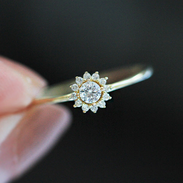 Side profile of the sunflower ring, displaying the elegant gold band and floral diamond setting.