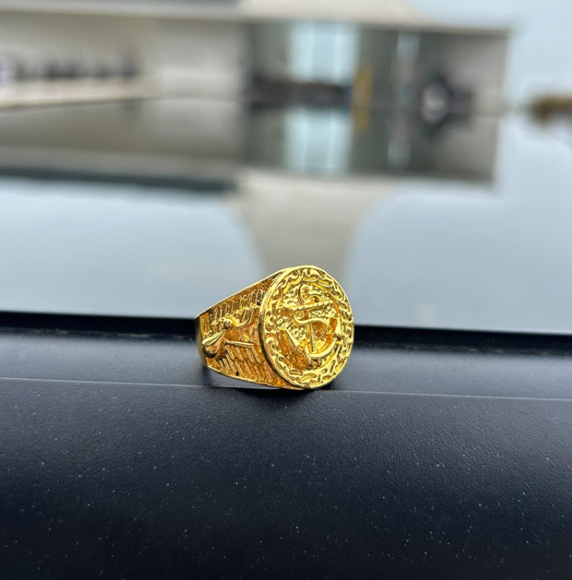 Side profile of the intricate gold plated ring