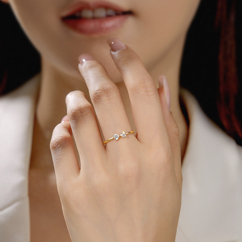 Model showcasing the 18K gold plated double heart CZ ring on her finger