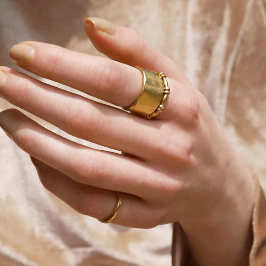 Model wearing the French-style gold open rings to show how they look when worn.