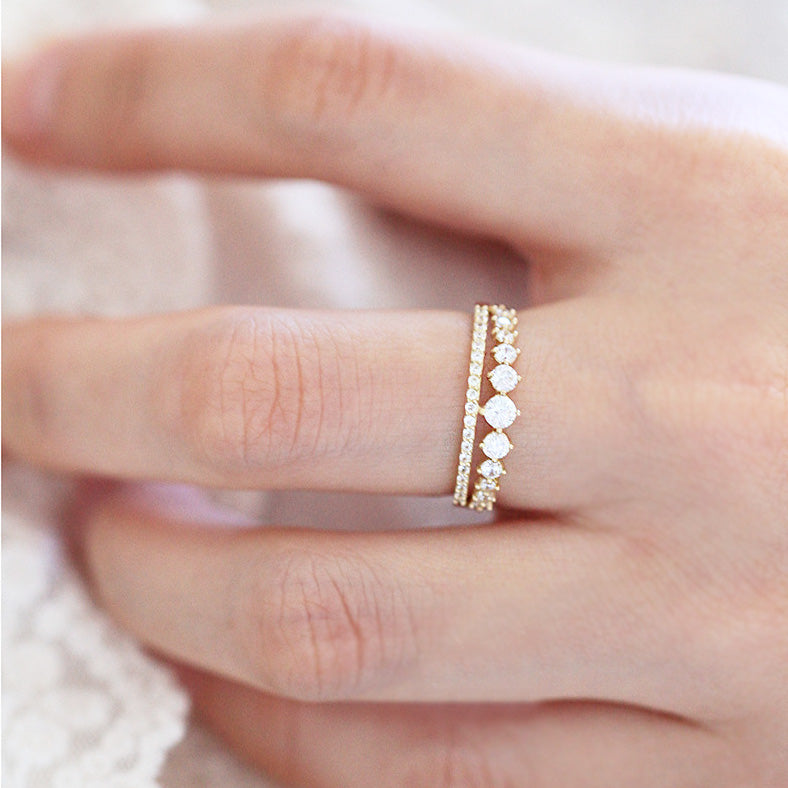 A woman's hand adorned with the beautiful double-row pavé crystal rings