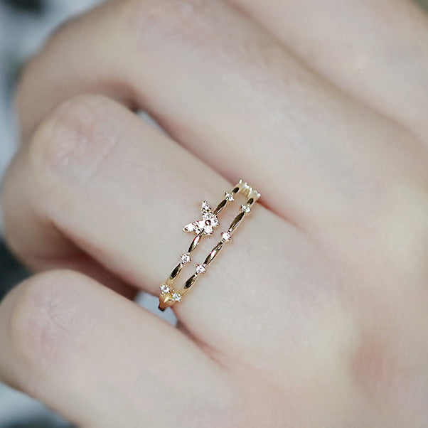 Model showcasing the adjustable fit of the double-layer butterfly ring