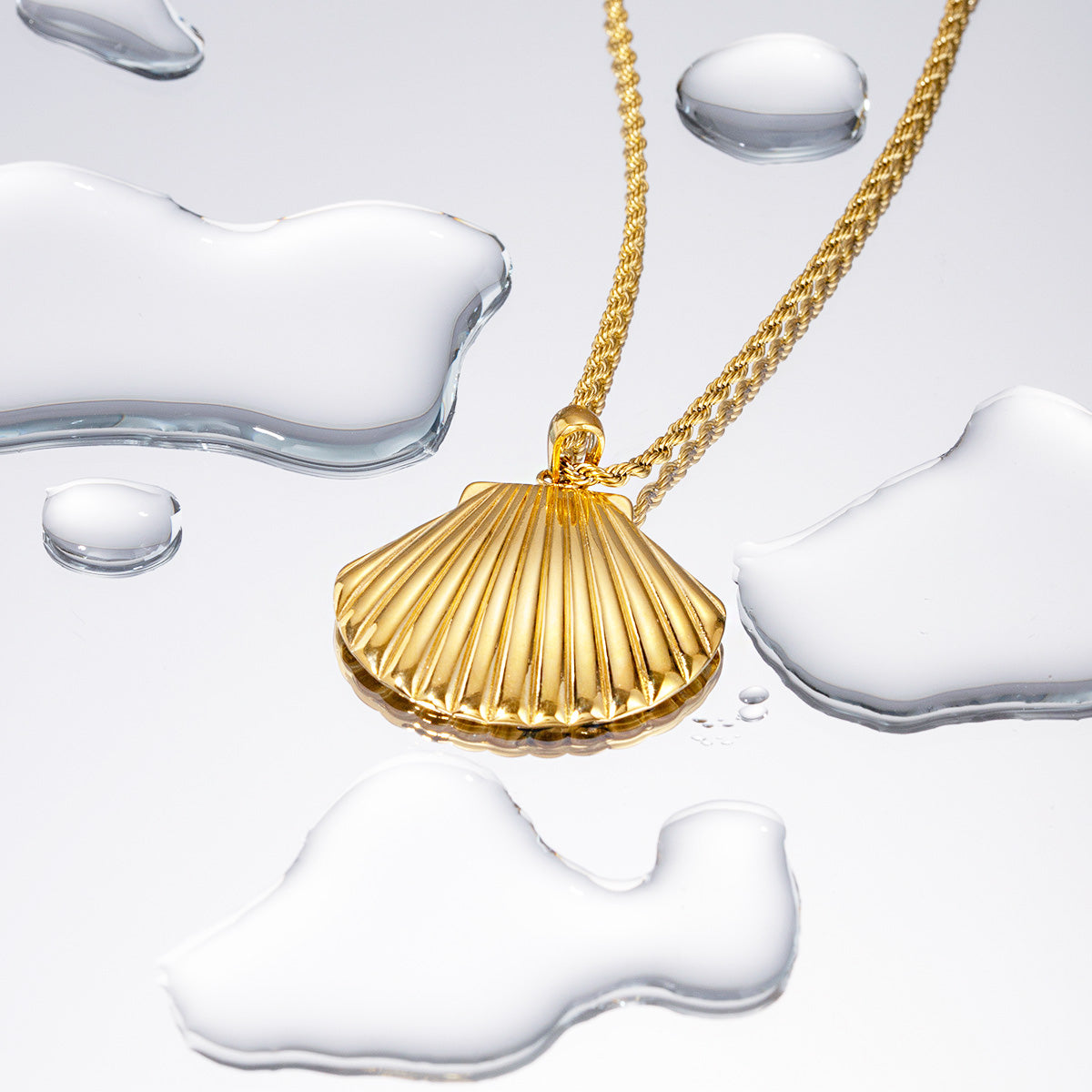 Waterproof stainless steel shell necklace on a beach-themed background