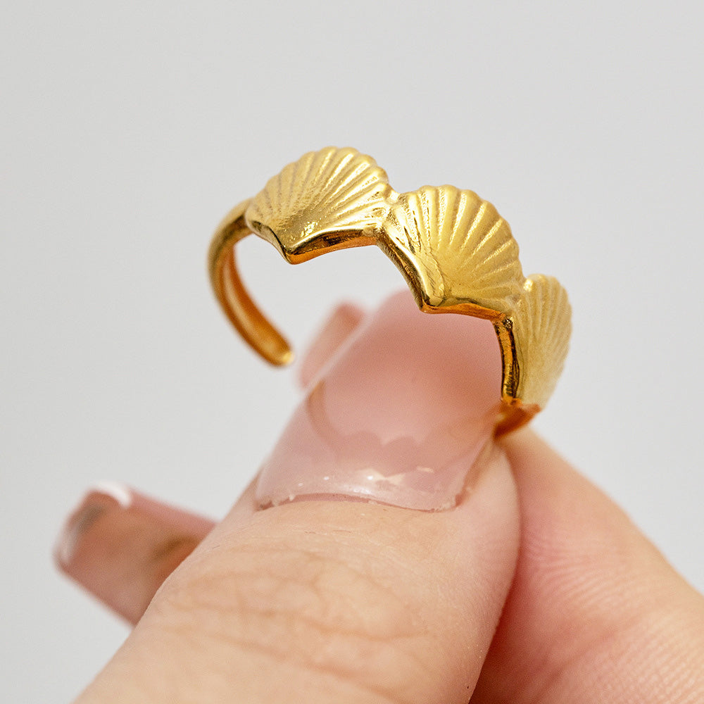 Detailed view of the gold stainless steel shell ring