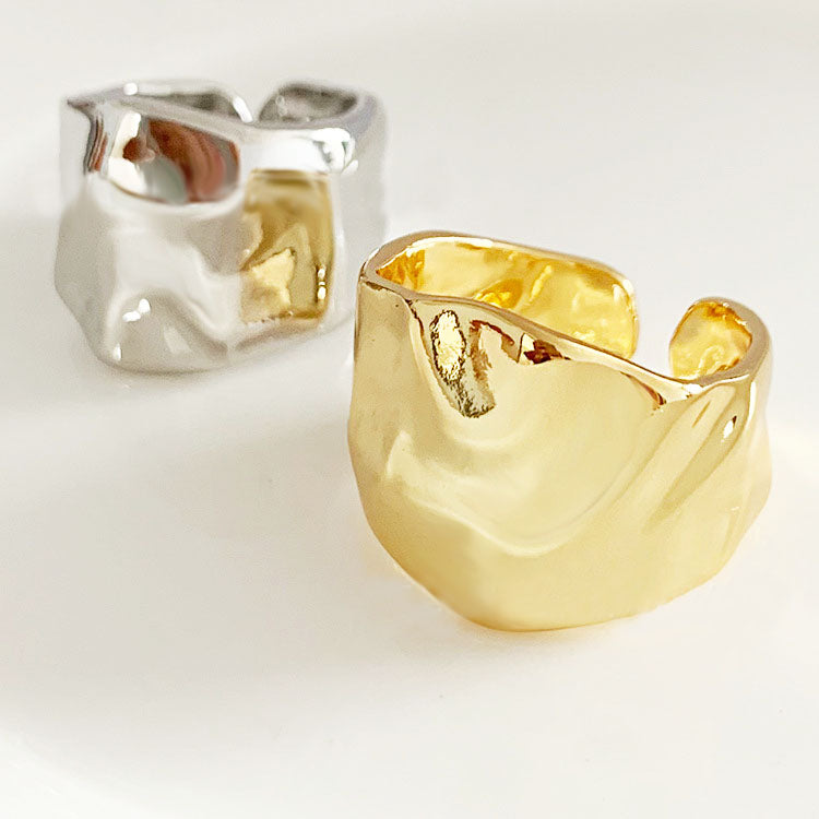 A pair of gold and silver hammered geometric open rings