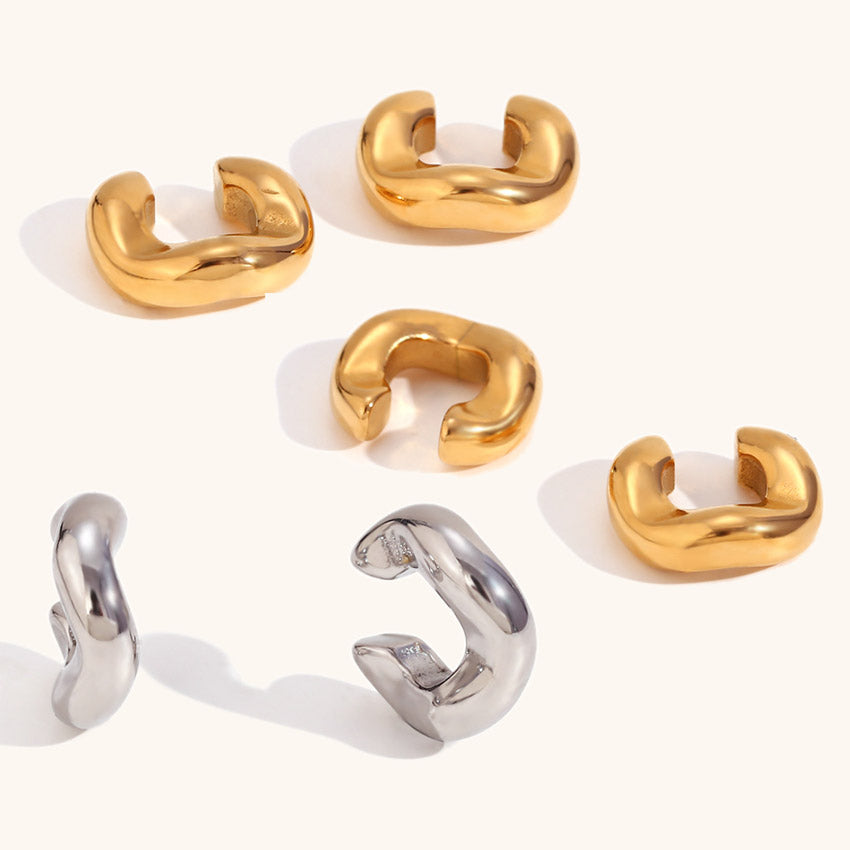 A variety of gold and silver stainless steel ear cuffs