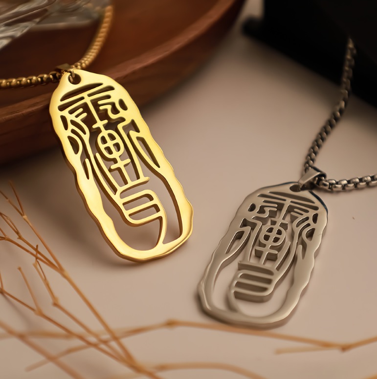 Examples of custom Chinese symbol pendants in gold and silver finishes