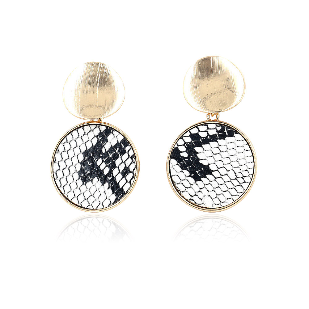 A close-up view of the snakeskin PU leather earring's texture and gold finish.
