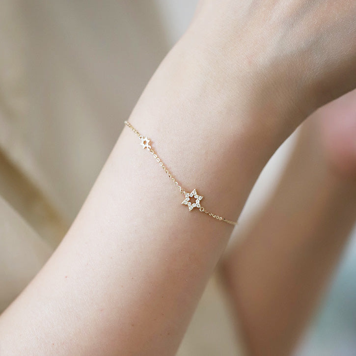 Model wearing the gold hexagram star bracelet