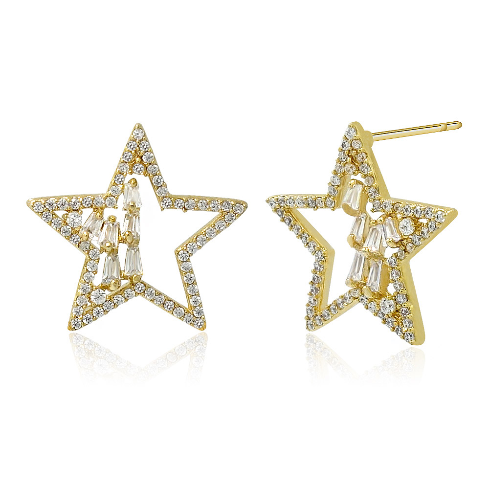 Detailed view of the gold star stud earrings with clear cubic zirconia gemstones