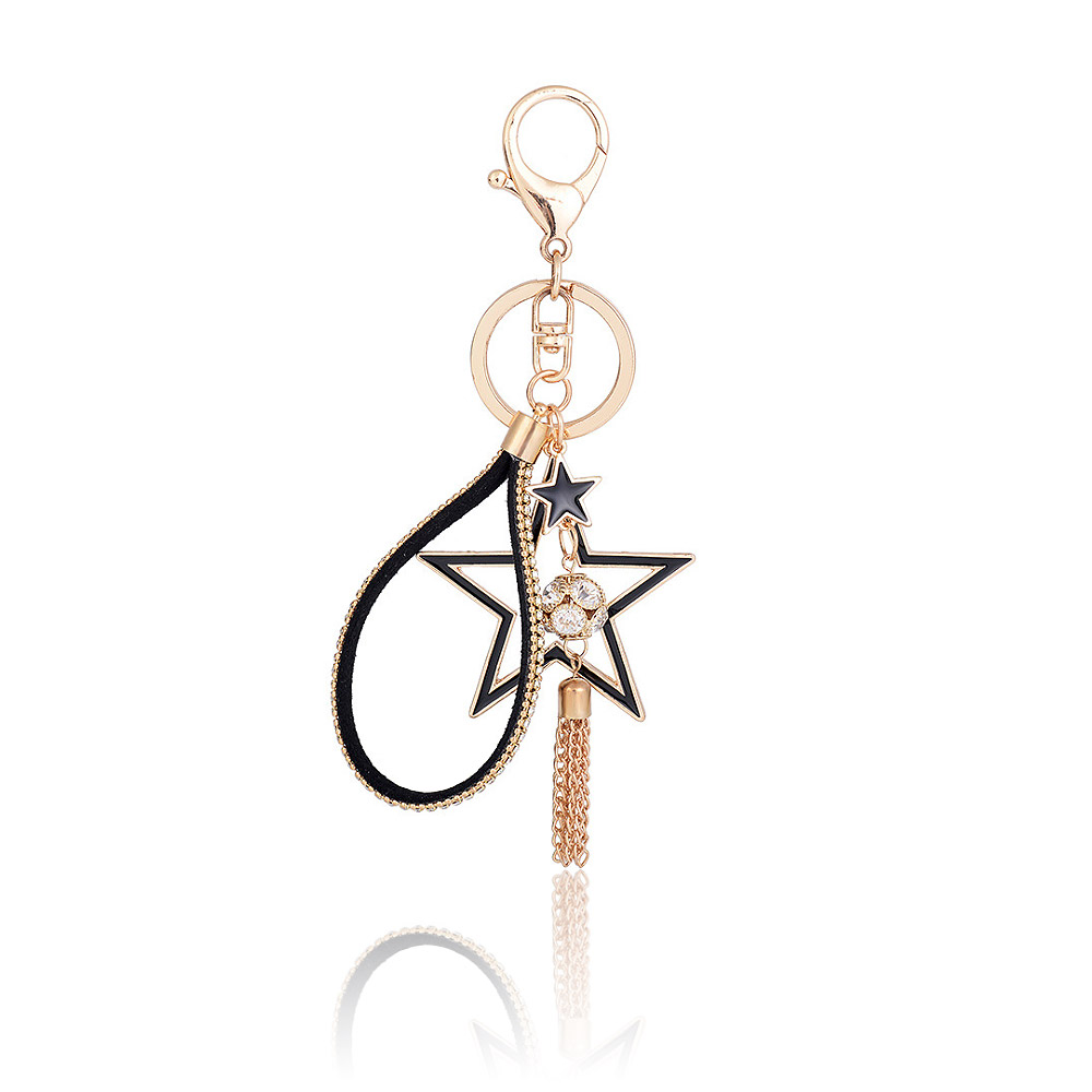 Detailed view of the Bling Crystal Gold Star Key Chain with its tassel and leather cord.