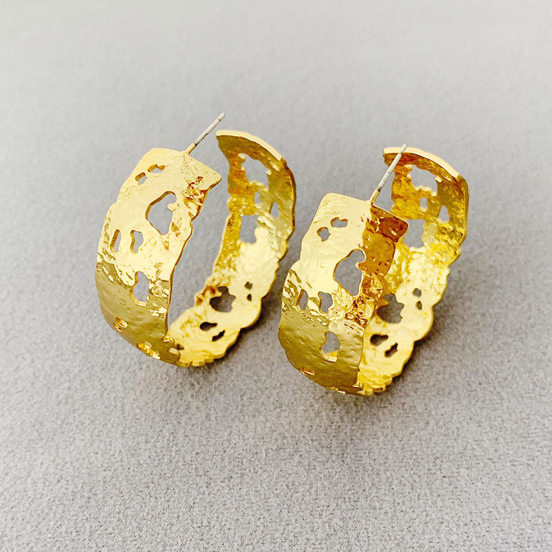 Close-up of the gold gothic hoop earring's texture