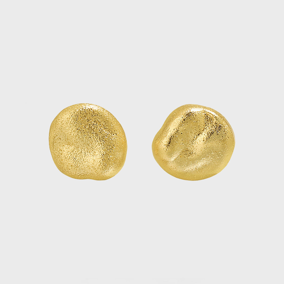 A model showcasing the elegant 18K gold-plated minimalist round stud earrings.