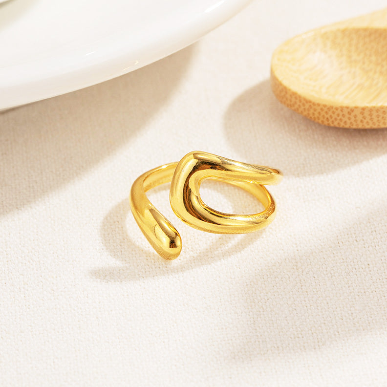 Detailed view of the gold wavy design ring