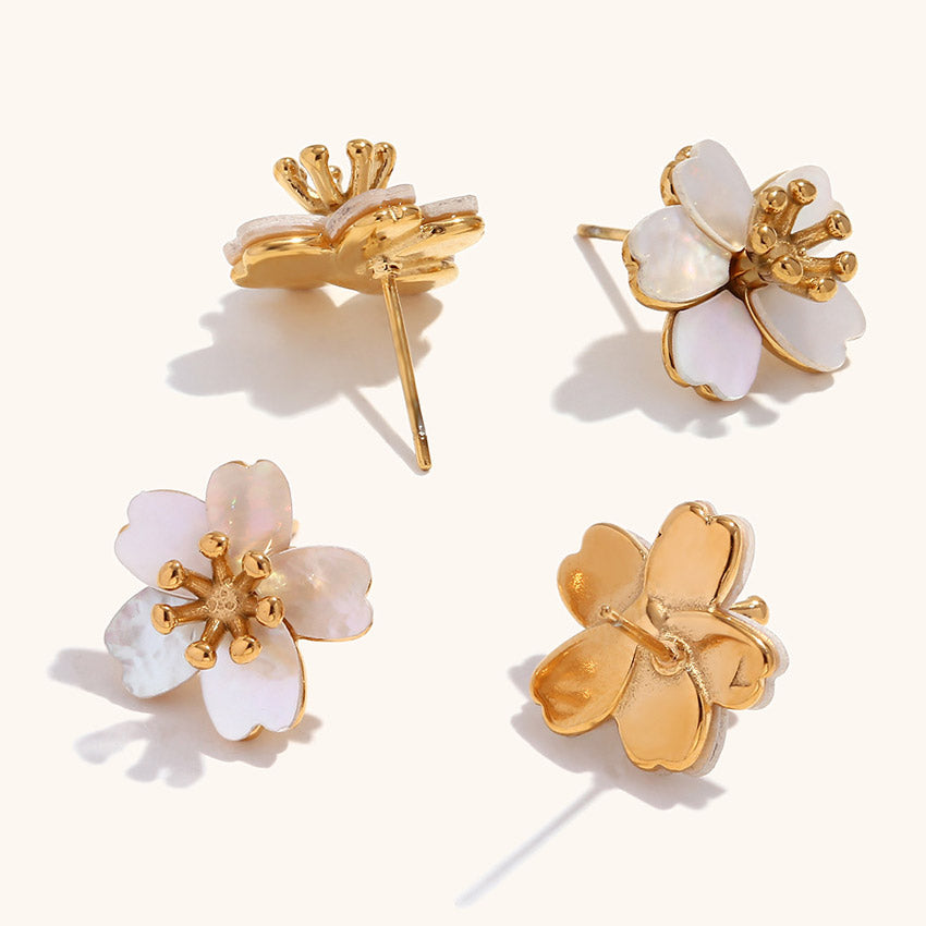 A set of five pairs of 18K gold mother of pearl flower earrings