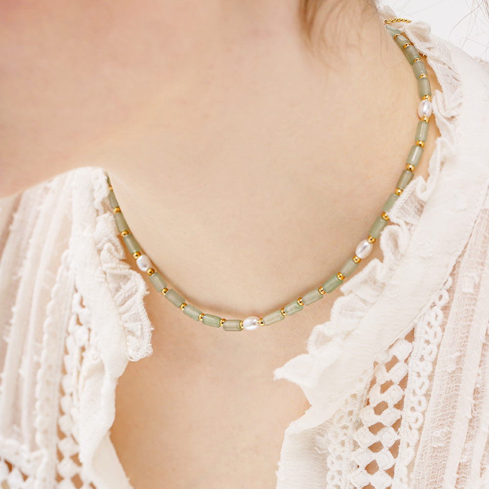 Model showcasing the green natural stone and pearl boho necklace
