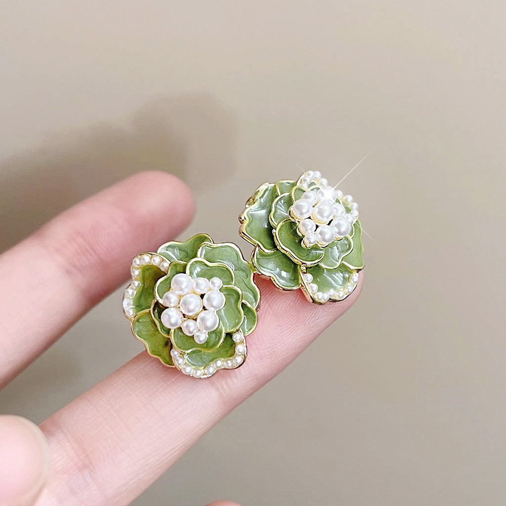 Green enamel camellia flower earrings with pearl centers