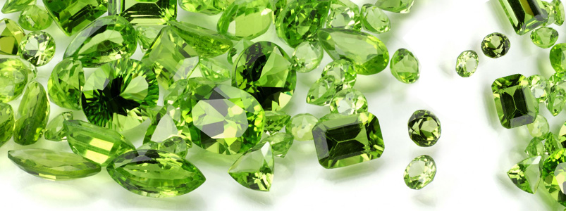 A variety of light green peridot gemstones, the vibrant birthstone for August.