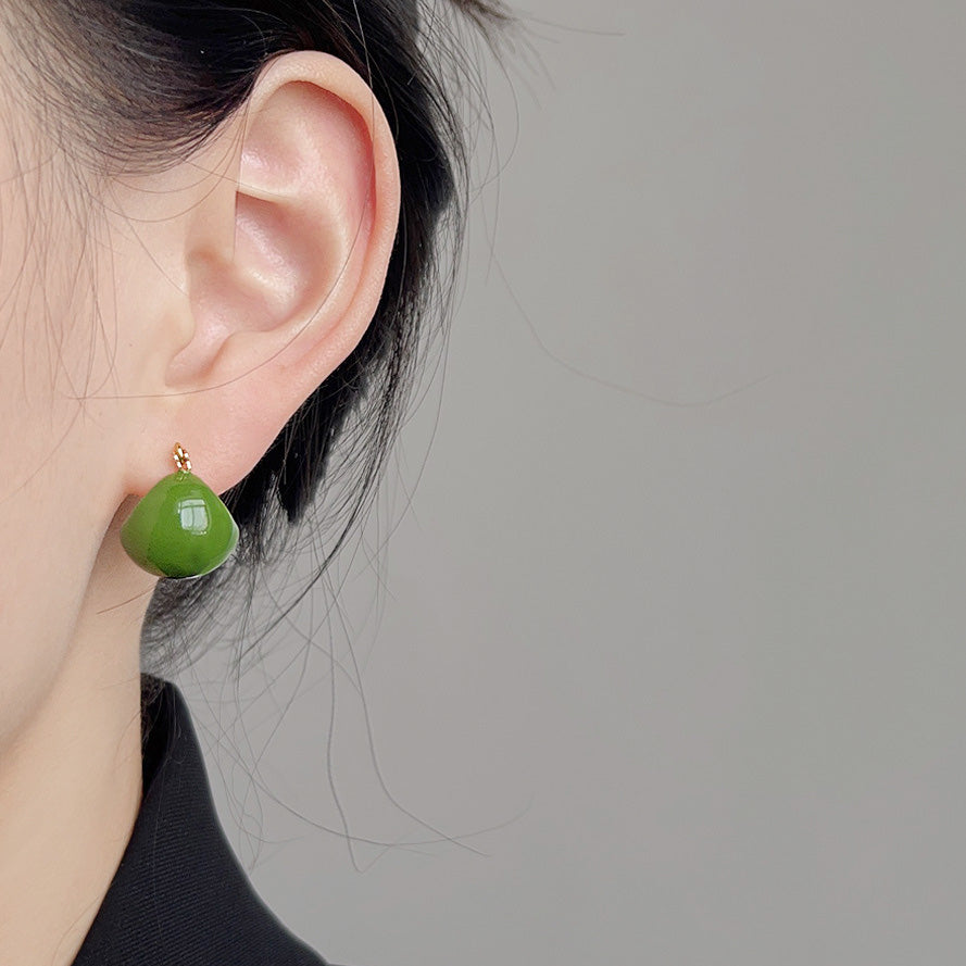 Model wearing the vintage green enamel hoop earring