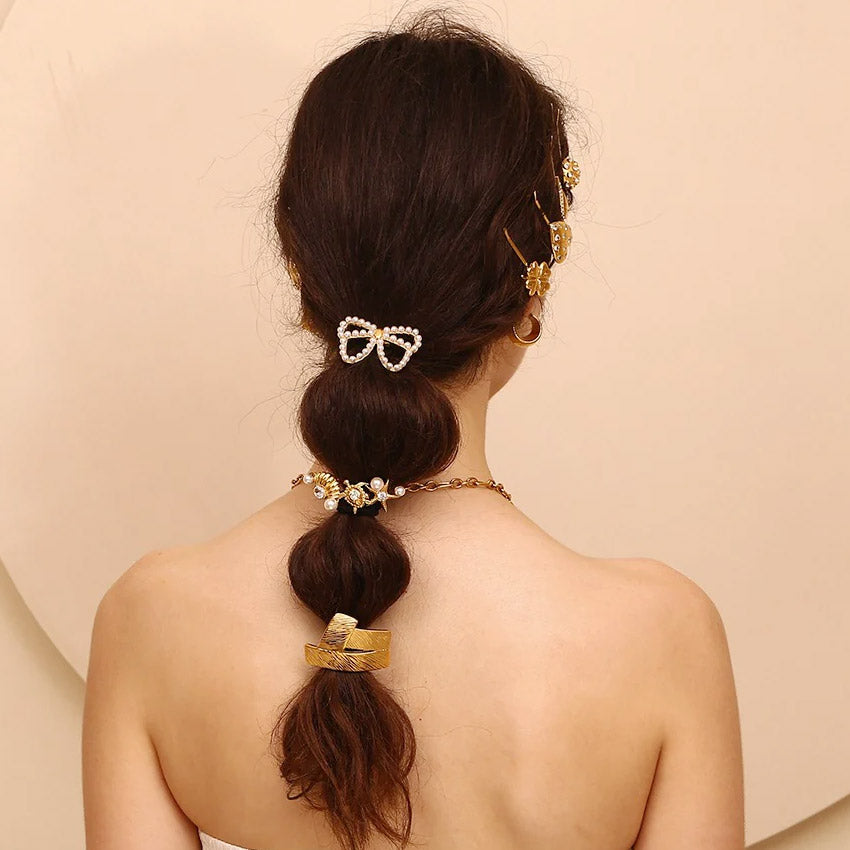 A model showcasing the elegant application of the starfish hair ties in a ponytail.