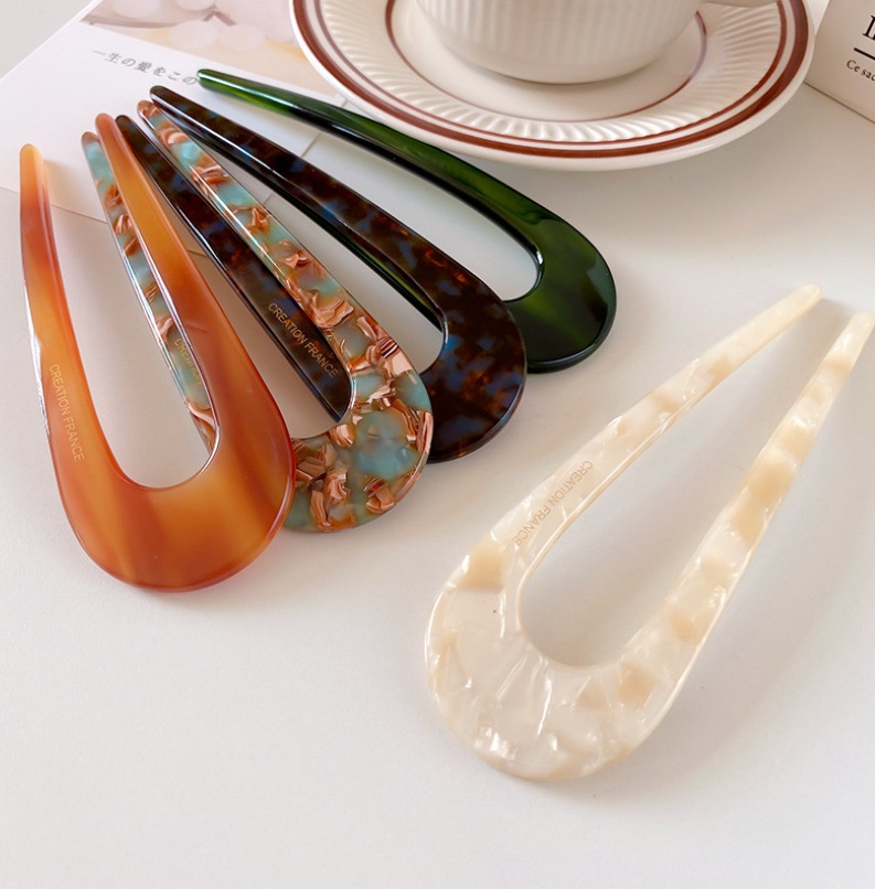 Assortment of U-shaped French style hair clips in different colors and patterns