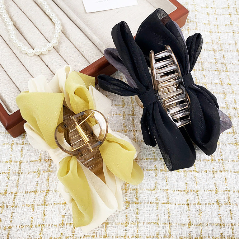 Two fabric bow hair clips in green/white and black/grey