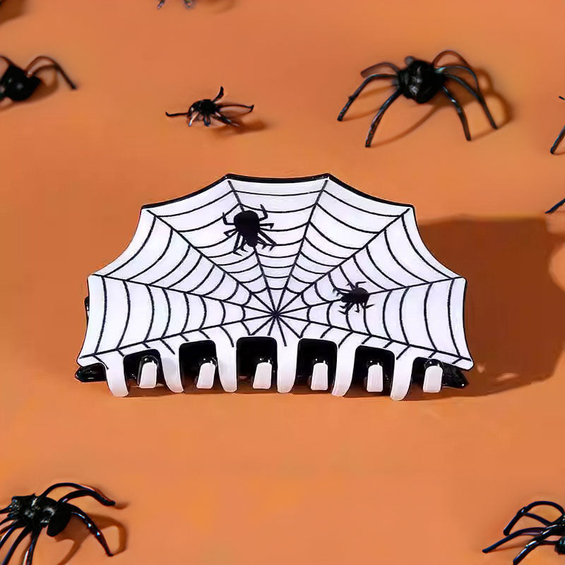 Detailed view of the white spider web hair claw.