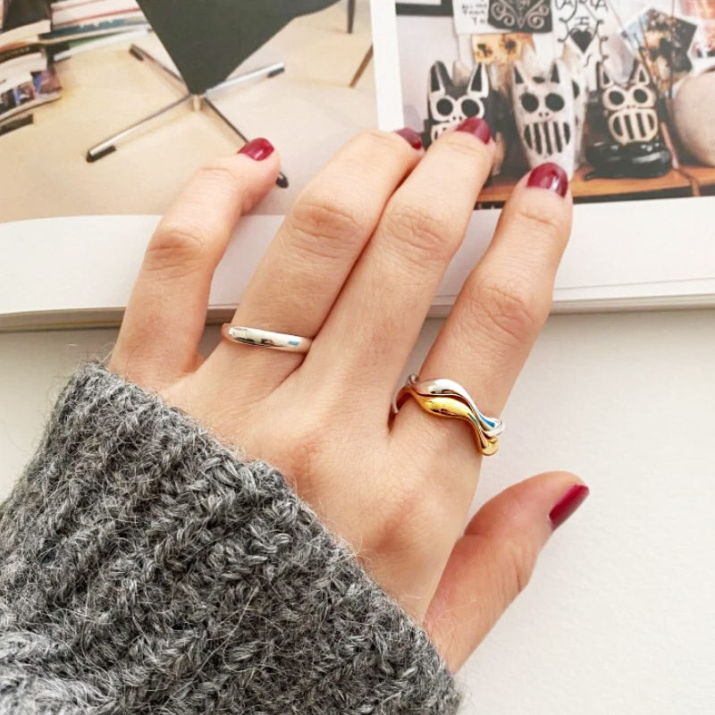 A model wearing the stackable wavy rings to showcase their stylish look.
