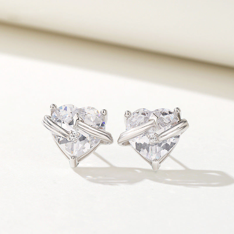 Detailed view of the heart-shaped zircon stud earrings