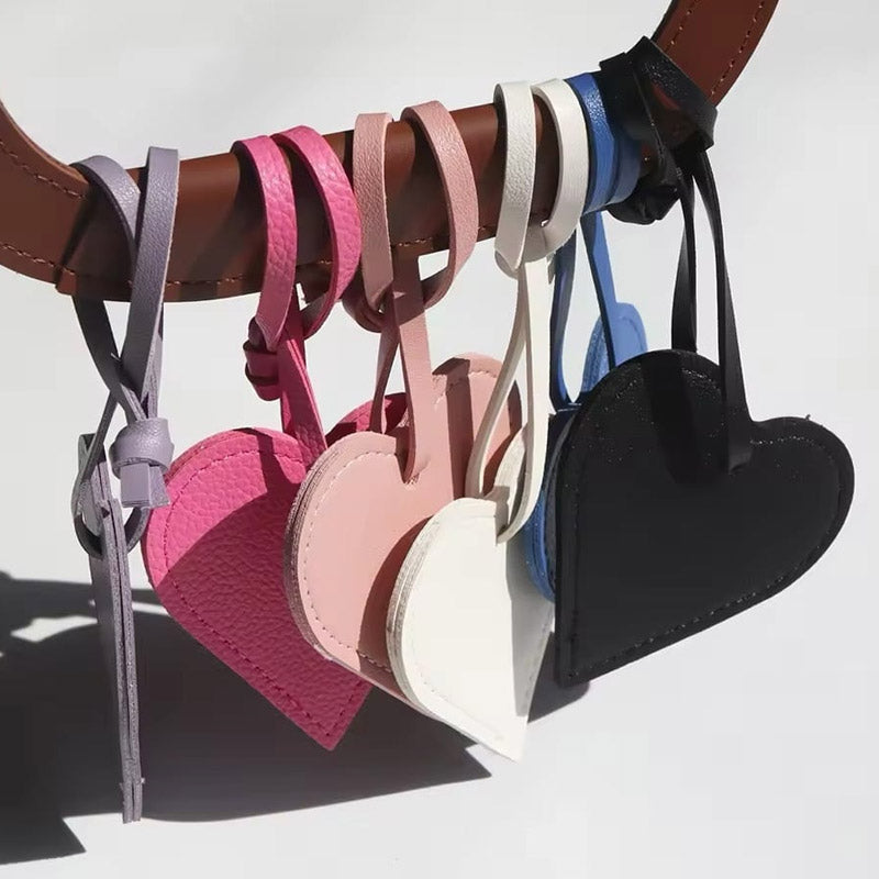 A vibrant display of heart-shaped PU leather charms in multiple colors