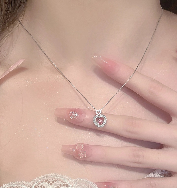 Model wearing the 925 Sterling Silver Dancing CZ Open Heart Necklace