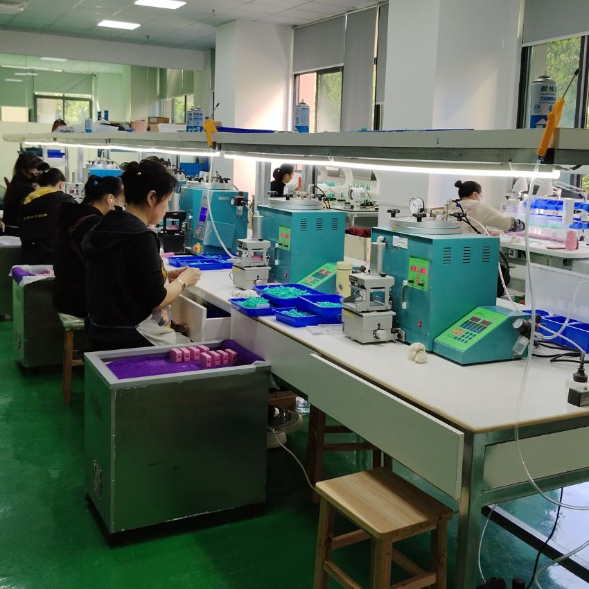The modern and organized workshop of JR Fashion Accessories, where skilled technicians perform jewelry assembly.