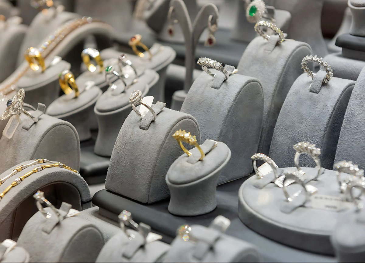 A variety of custom rings and bracelets in gold and silver.