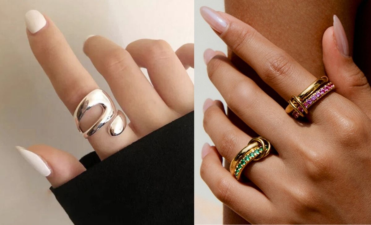 Hands modeling minimalist gold and silver stainless steel rings.