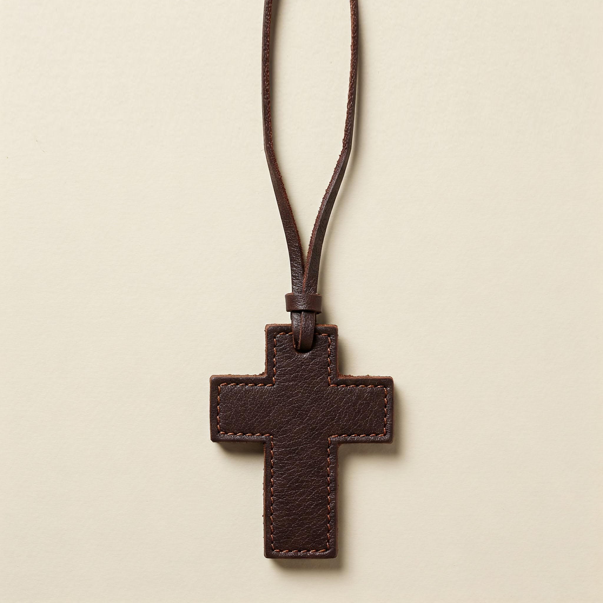 Close-up of a high-quality leather cross charm