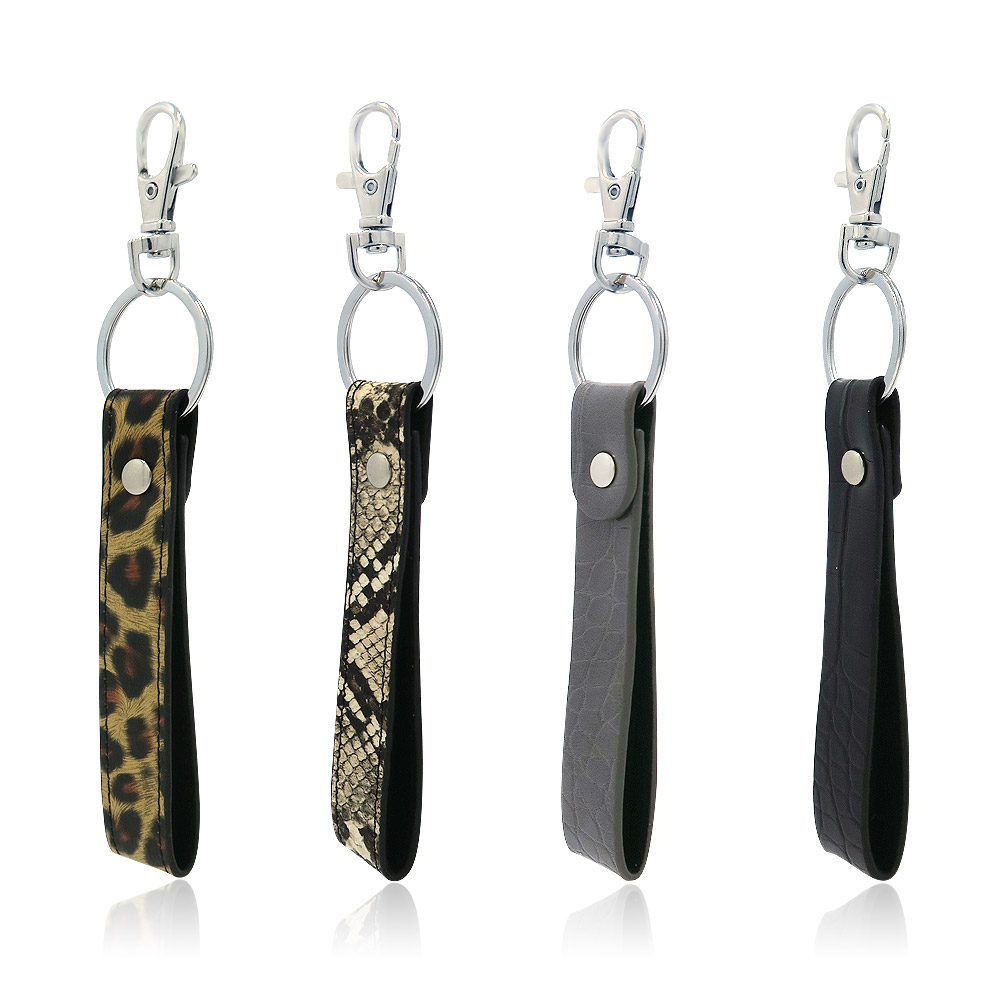 A collection of PU leather wrist strap keychains in various colors and patterns