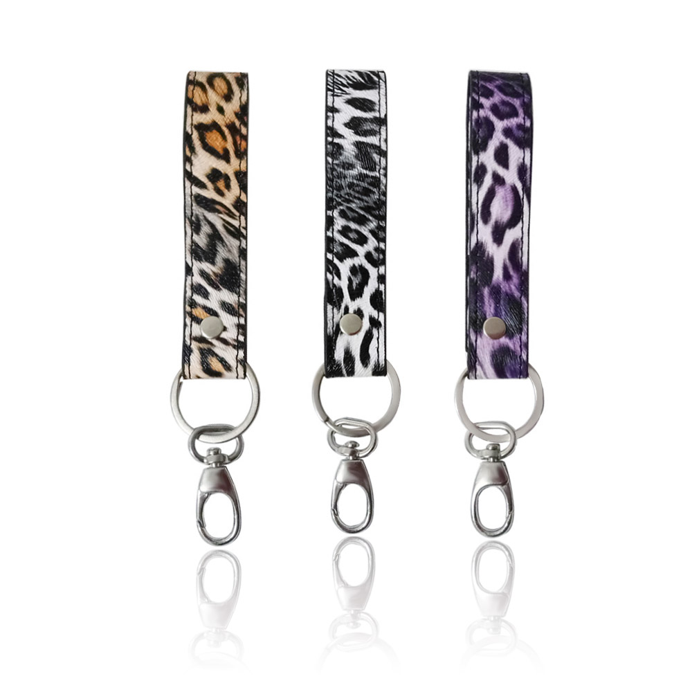 A set of three stylish PU leather hand loop key rings with different leopard print patterns