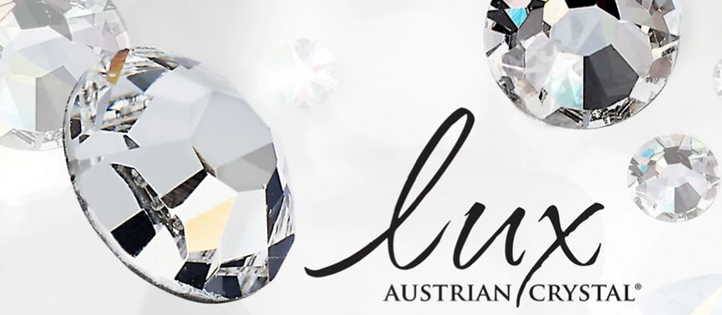Lux Austrian Crystal logo, known for its precision-cut and brilliant crystals.