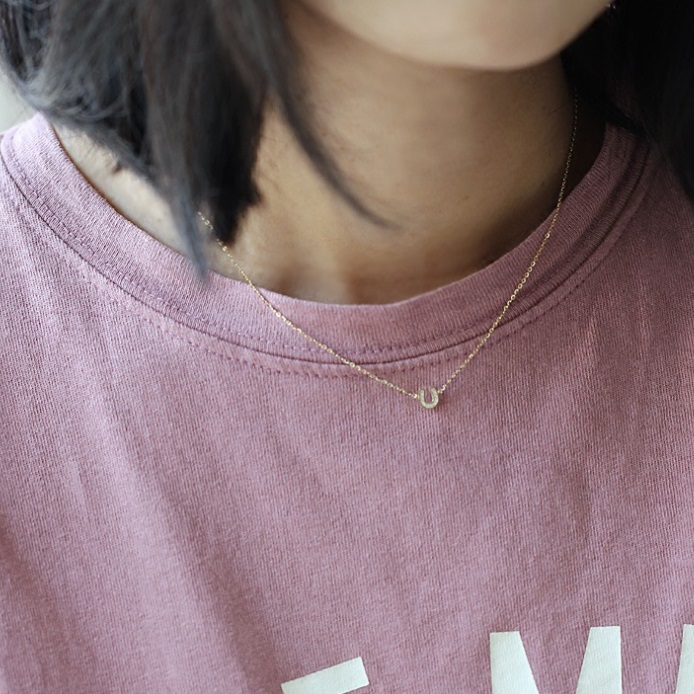 Model wearing the 925 Sterling Silver Horseshoe Necklace to showcase its length and style.