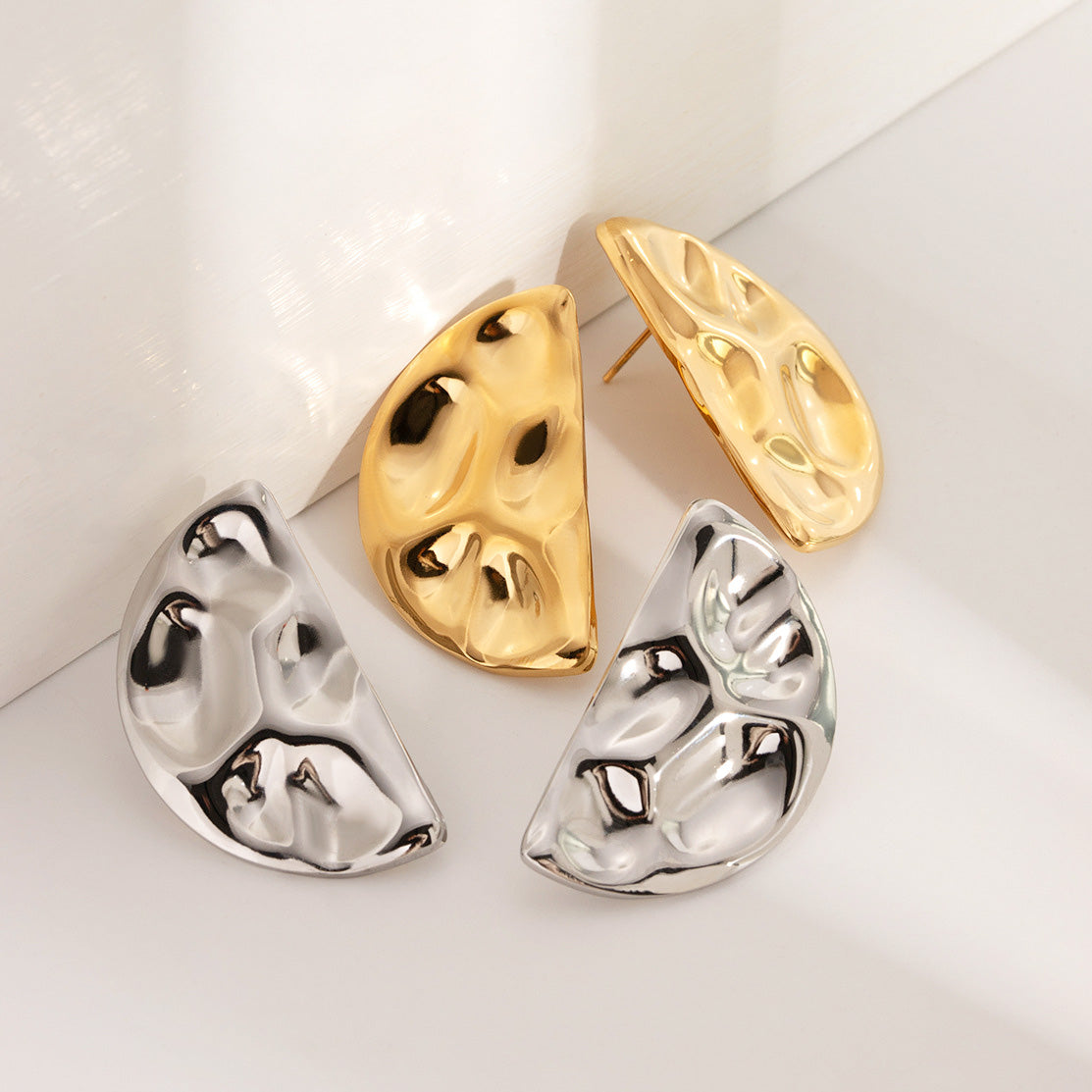 Gold and silver hammered half-circle earrings