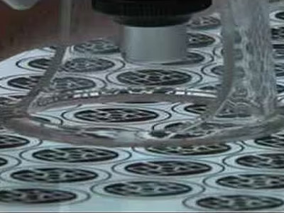 Microscopic view of acid etching on a metal surface