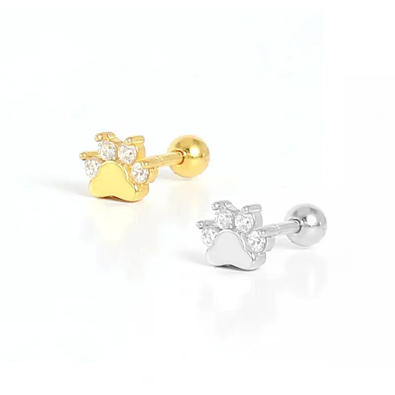 Close-up of the sterling silver paw print earrings in both gold and silver finishes, highlighting the CZ stones.