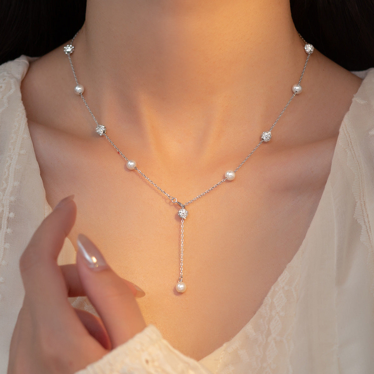 Detailed view of the 925 silver necklace with pearls and CZ stones