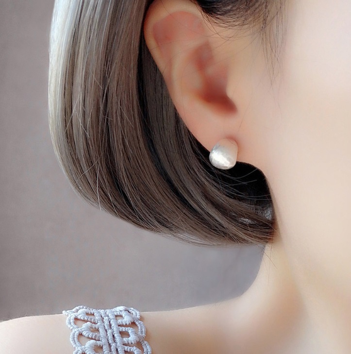 Model showcasing the 925 Sterling Silver Spherical Shape Earring