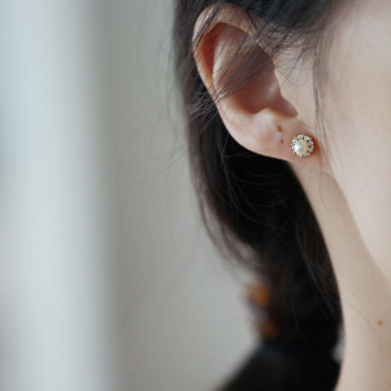 Model wearing the dainty 925 sterling silver pearl stud earring