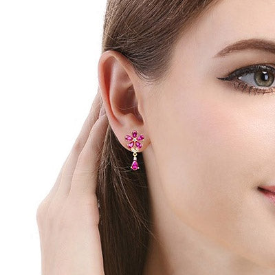 Model showcasing the 925 Sterling Silver Pink Zirconia Flower Drop Earrings.