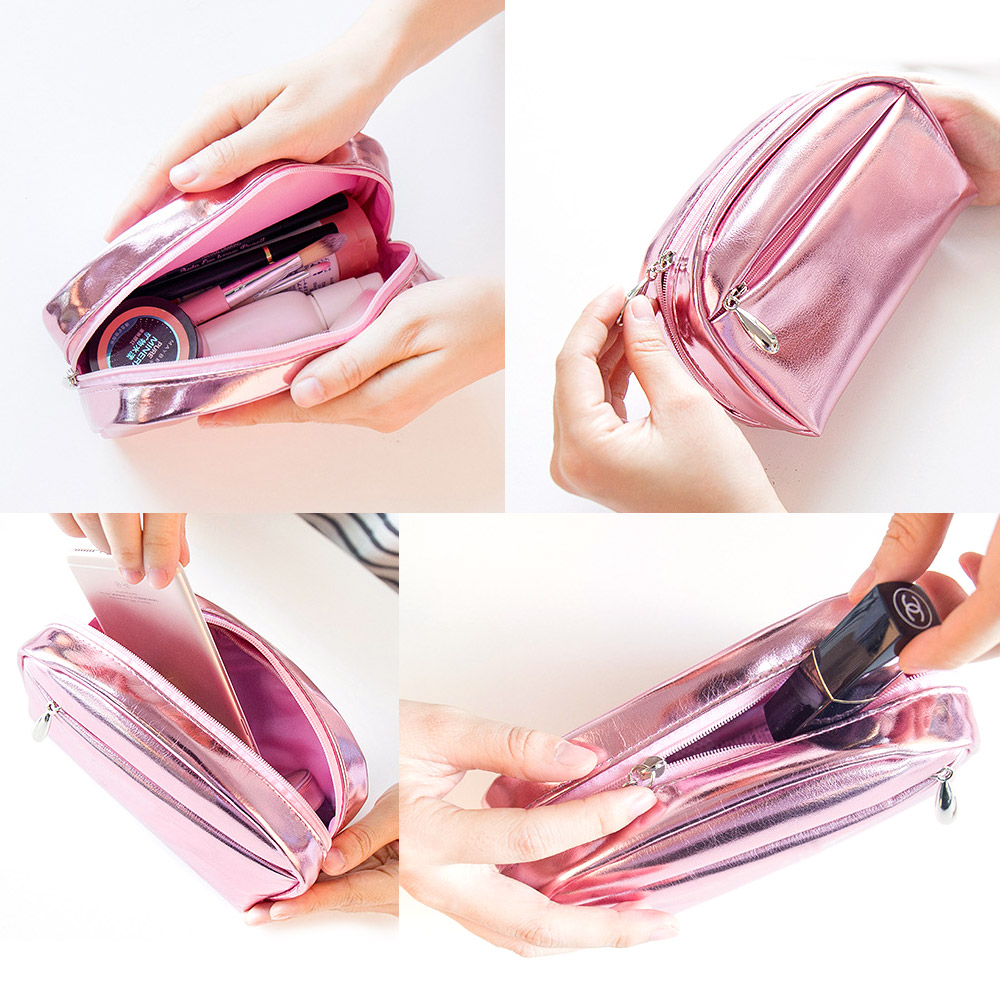 Spacious interior of the pink PU leather makeup bag showing various cosmetics