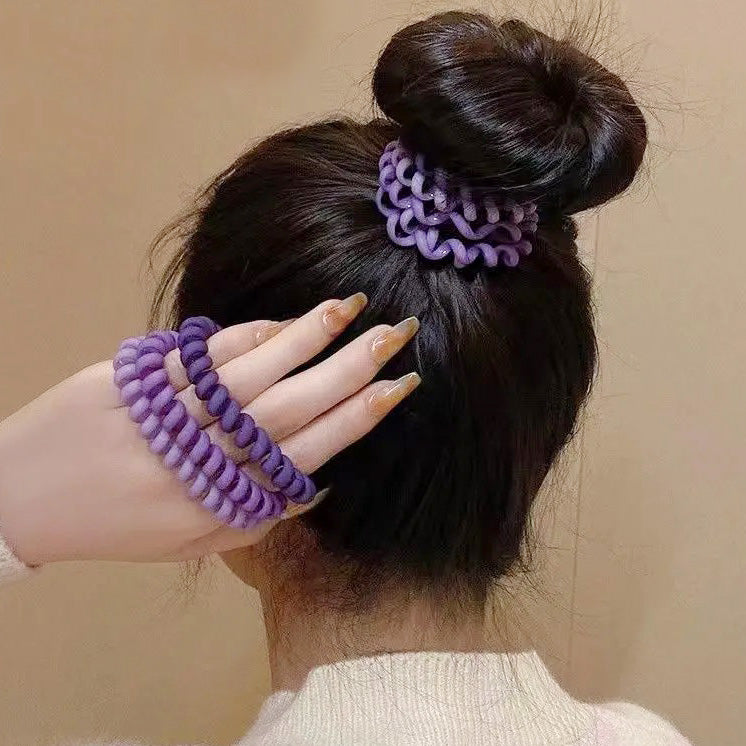 Spiral hair tie worn as a bracelet