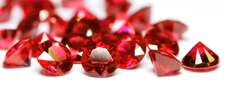 A collection of deep red rubies, the passionate birthstone for July.